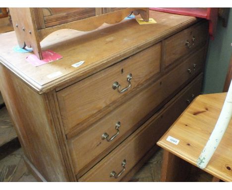 A light oak chest of two short and two long drawers