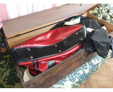 A pine storage box with contents including vintage tennis racquets, cricket bat etc