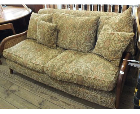 A modern Multiyork three seater sofa with bergere ends with cream and gold thistle design upholstery