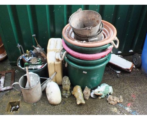 A petrol can, various sized garden tubs, tools etc