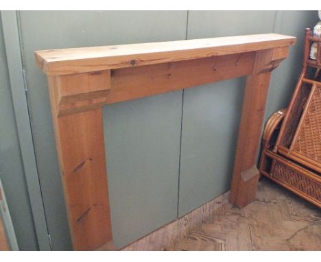 A modern pine fire surround, internal measurements 37" x 37 1/2" and a quantity of turned wooden legs
