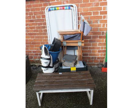 A donkey shaped planter, a bench, two deck chairs, two directors chairs, bucket, plastic tool box in the form of a seat 