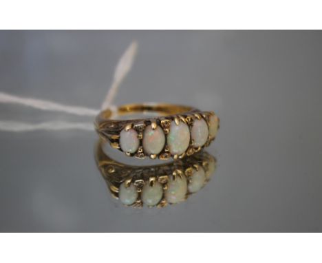 A GRADUATING FIVE STONE OPAL RING, band stamped '14', ring size N