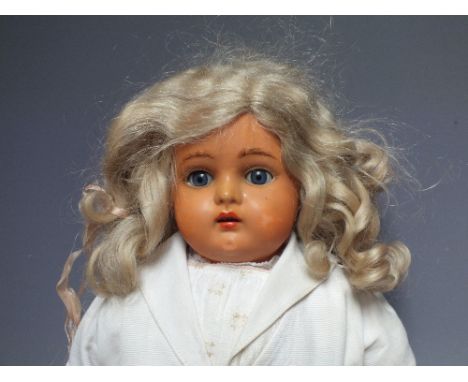 KAMMER &amp; REINHARDT - A Kammer &amp; Reinhardt doll with celluloid head, jointed body, blue sleeping glass eyes, open mout