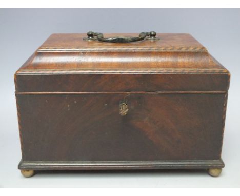 A GEORGIAN INLAID TEA CADDY, the hinged lid opening to a later fitted interior, carry handle, raised on four bun feet, W 26.5