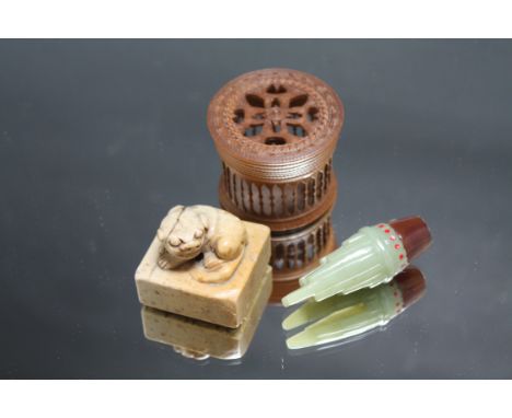 A CHINESE SOAP STONE SEAL, together with a jade amulet and a small cricket cage (3)