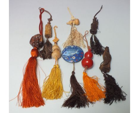 FOUR ORIENTAL CARVED WOODEN FIGURAL TOGGLES, together with three double gourd shaped examples and circular enamel example, ea