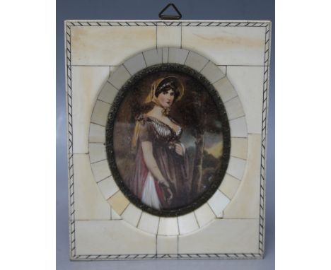 A 20TH CENTURY OVAL PORTRAIT MINIATURE ON IVORINE depicting a young woman wearing a bonnet, landscape beyond, indistinctly si