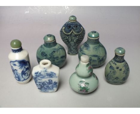 A COLLECTION OF ORIENTAL CERAMIC SNUFF BOTTLES, varying styles and decoration, to include an unusual fish shaped example, all