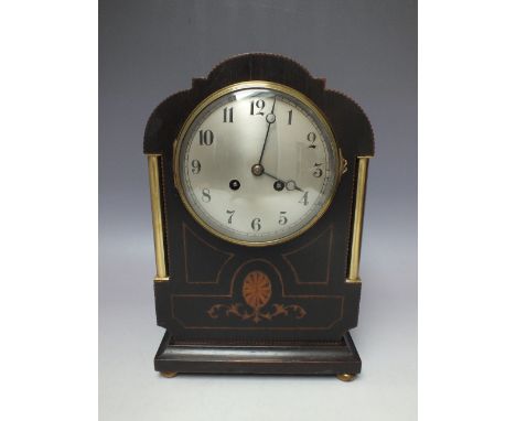 A LATE 19TH / EARLY 20TH CENTURY FRENCH MAHOGANY AND OAK CASED MANTLE CLOCK, the circular silvered dial with Arabic numerals,