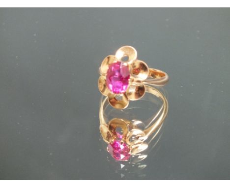 A RUSSIAN HALLMARKED DRESS RING, set with a pink stone - possibly a Russian ruby, ring stamped on the outer side of the band 