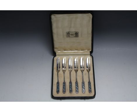 LIBERTY'S - A CASED SET OF SIX LIBERTY'S OF LONDON HALLMARKED SILVER AND ENAMEL CAKE FORKS - BIRMINGHAM 1934