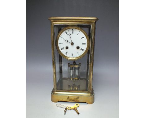 A FRENCH BRASS FOUR GLASS MANTEL CLOCK WITH JAPY FRERES MOVEMENT, white enamel dial with Roman numerals, the four glass case 