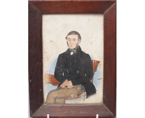 A 19TH CENTURY MINIATURE PORTRAIT STUDY OF A SEATED GEORGIAN GENTLEMAN, unsigned, watercolour on paper, framed and glazed, 15