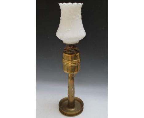 AN UNUSUAL TRENCH ART CONVERTED OIL LAMP, the circular base with central shell case column having inset bullet decoration, du