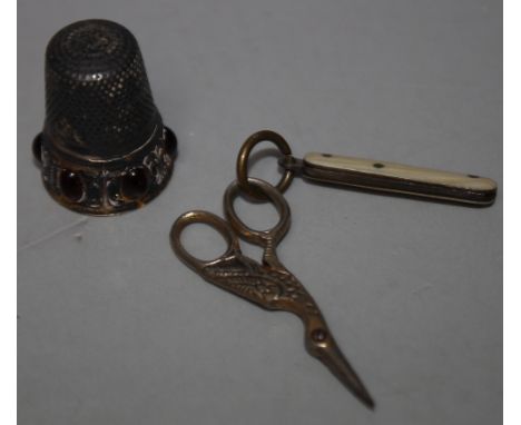 A SILVER GEMSET THIMBLE, marked 800, H 2.5 cm, together with a miniature ivory handled penknife, L 6.5 cm and pair of miniatu