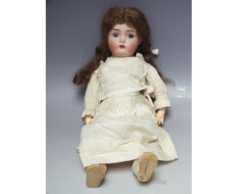 KAMMER &amp; REINHARDT -  A Kammer &amp; Reinhardt bisque head doll, jointed body, blue sleeping glass eyes, open mouth beari