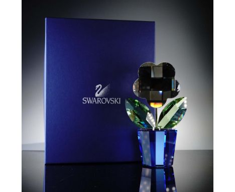 An eye-catching statement piece by Swarovski, this crystal flower figurine dazzles with its large geometric bloom in deep mir