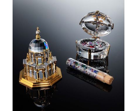 This Swarovski Crystal Memories set features two intricately crafted miniatures: the "Secrets" gift box and the "Journeys" ca