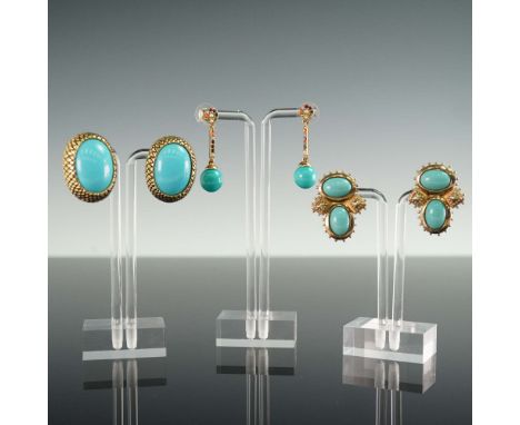 A bold and colorful group of three pairs of vintage costume earrings featuring vibrant turquoise-colored stones set in ornate