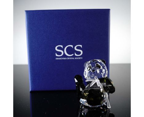 This delightful Swarovski Crystal Society (SCS) figurine features an adorable panda bear crafted in clear and jet black cryst