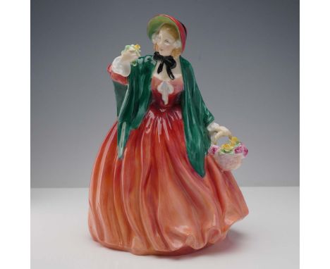This elegant porcelain figurine, titled Lady Charmian (HN1949), is part of the esteemed Harradine Classics series by Royal Do