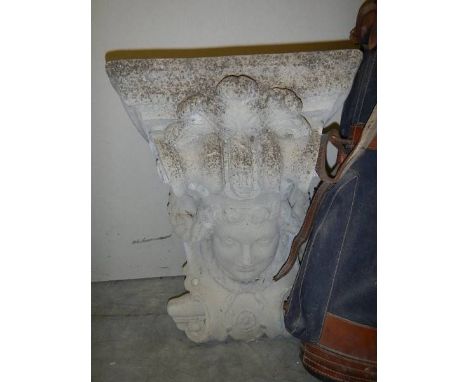 A concrete figure head wall bracket. 24" tall.