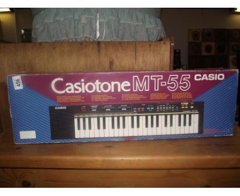 A boxed Casio MT-55 keyboard