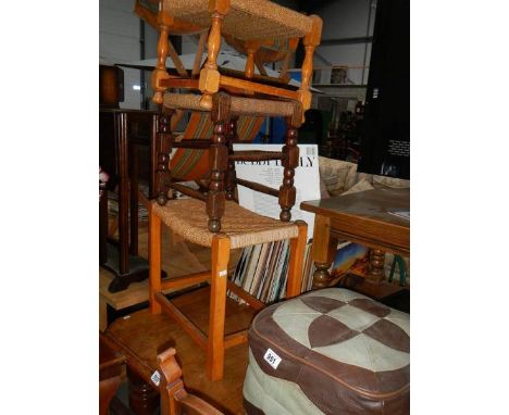 3 wicker stools and a pouffe.