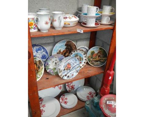 3 shelves of ceramic items.