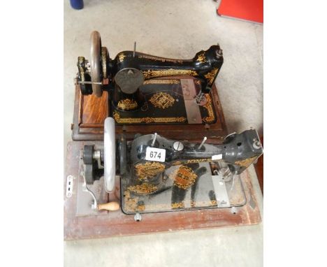 2 vintage sewing machines.