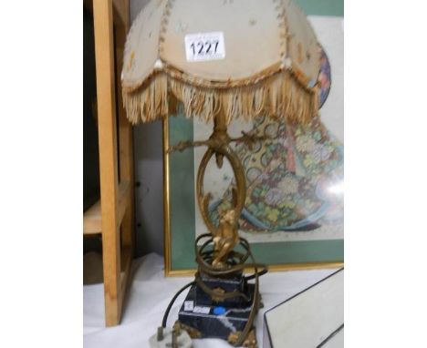An ormolu gilt cherub table lamp.