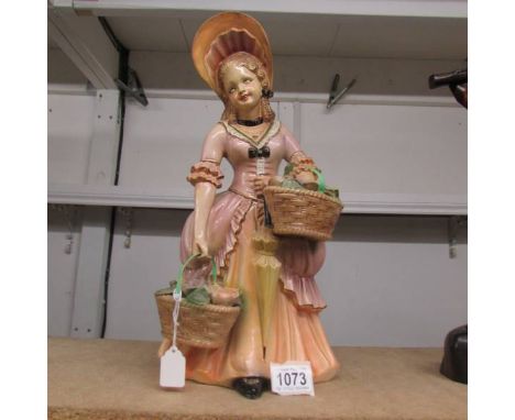 A 1950's ceramic figure in pastel shades, approximately 14" tall.