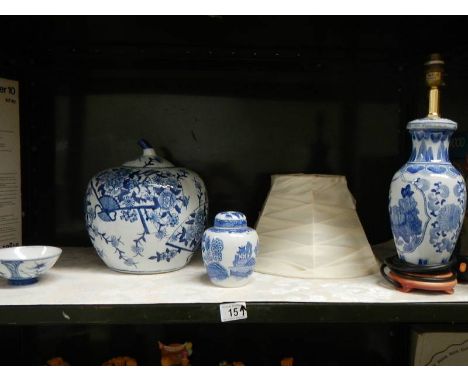 A mixed lot of blue and white including pumpkin jar and table lamp.