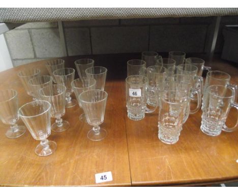 A dozen vintage 1/2 pint beer glasses and 10 wine glasses