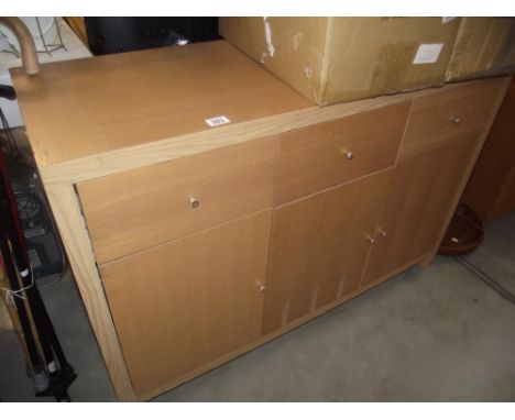 A light oak effect 3 drawer / 3 door unit