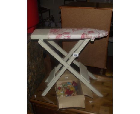 A vintage wood block jigsaw, building blocks, ironing board