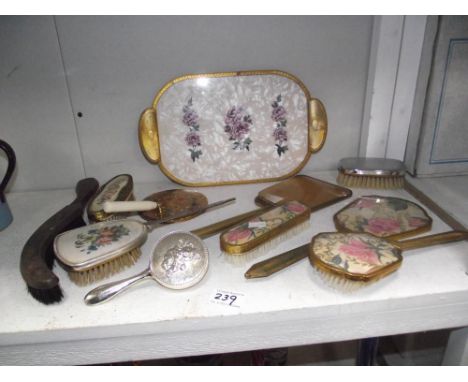 A quantity of vintage hair brushes, mirrors, tray and a table brush