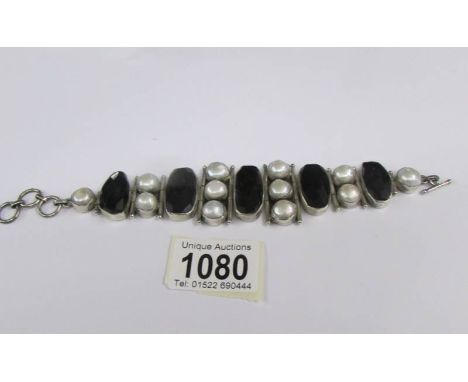 A vintage cased silver stone set bracelet, marked 925.