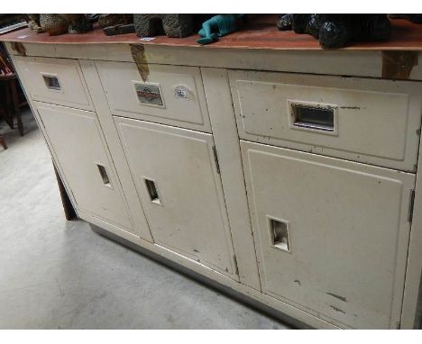A vintage (circa 1950's) metal kitchen cabinet, missing top.