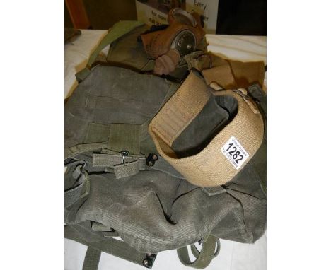 An army gas mask, holster etc.,