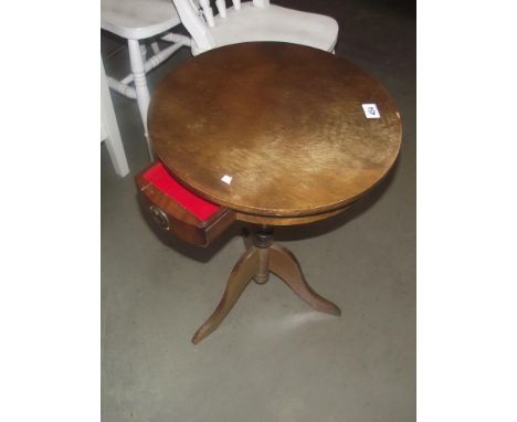 A round oak tripod side table with drawer