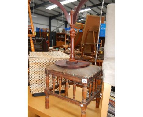 A piano stool and a tripod table.