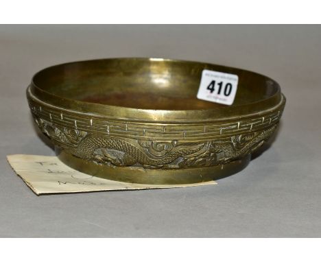 A LATE 19TH CENTURY CHINESE BRONZE BOWL, lacks cover, cast to the exterior with a key border above a band of dragons and clou