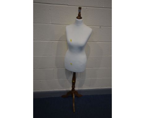 A FEMALE SHOP DISPLAY MANNEQUIN, on a beech tripod stand, height 151cm