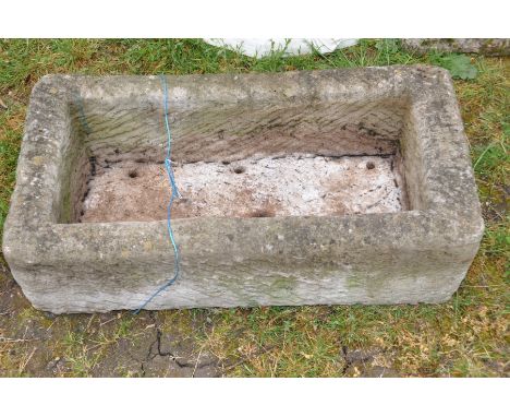 A COMPOSITE TROUGH width 77cm depth 40cm and height 23cm