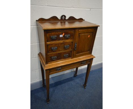 AN EARLY 20TH CENTURY OAK CABINET ON STAND, the cabinet with a shaped raised back, a bank of three drawers besides a single c