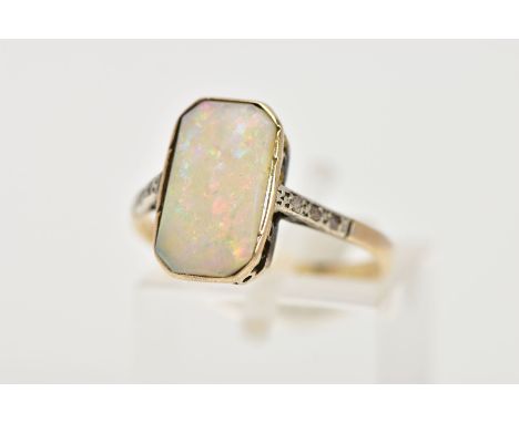 AN OPAL AND DIAMOND RING, the rectangular opal within a milligrain setting with diamond detail to the shoulders, ring size O,