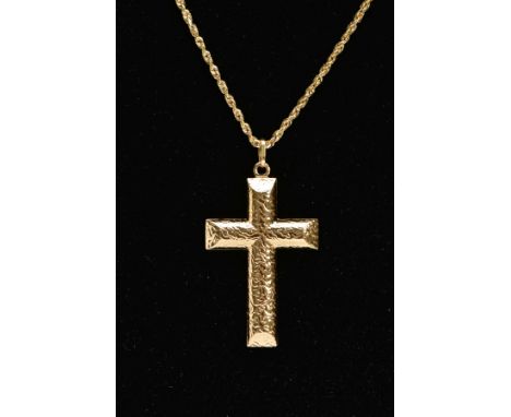 A YELLOW METAL CROSS PENDANT NECKLACE, textured hollow cross pendant, fitted with an oval suspension ring, stamped '750', len
