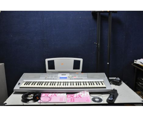 A YAMAHA DGX-205 PORTABLE GRAND KEYBOARD with PSU, manual, software, sustain pedal, stand and headphones (PAT pass and all ke